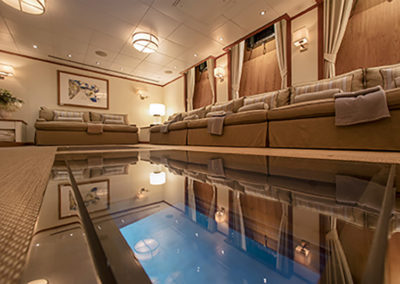 suri-adventure-yacht-charter-guest-accommodation-media-room-windows-to-the-sea